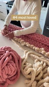 arm-knitting a large-scale chunky chenille blanket