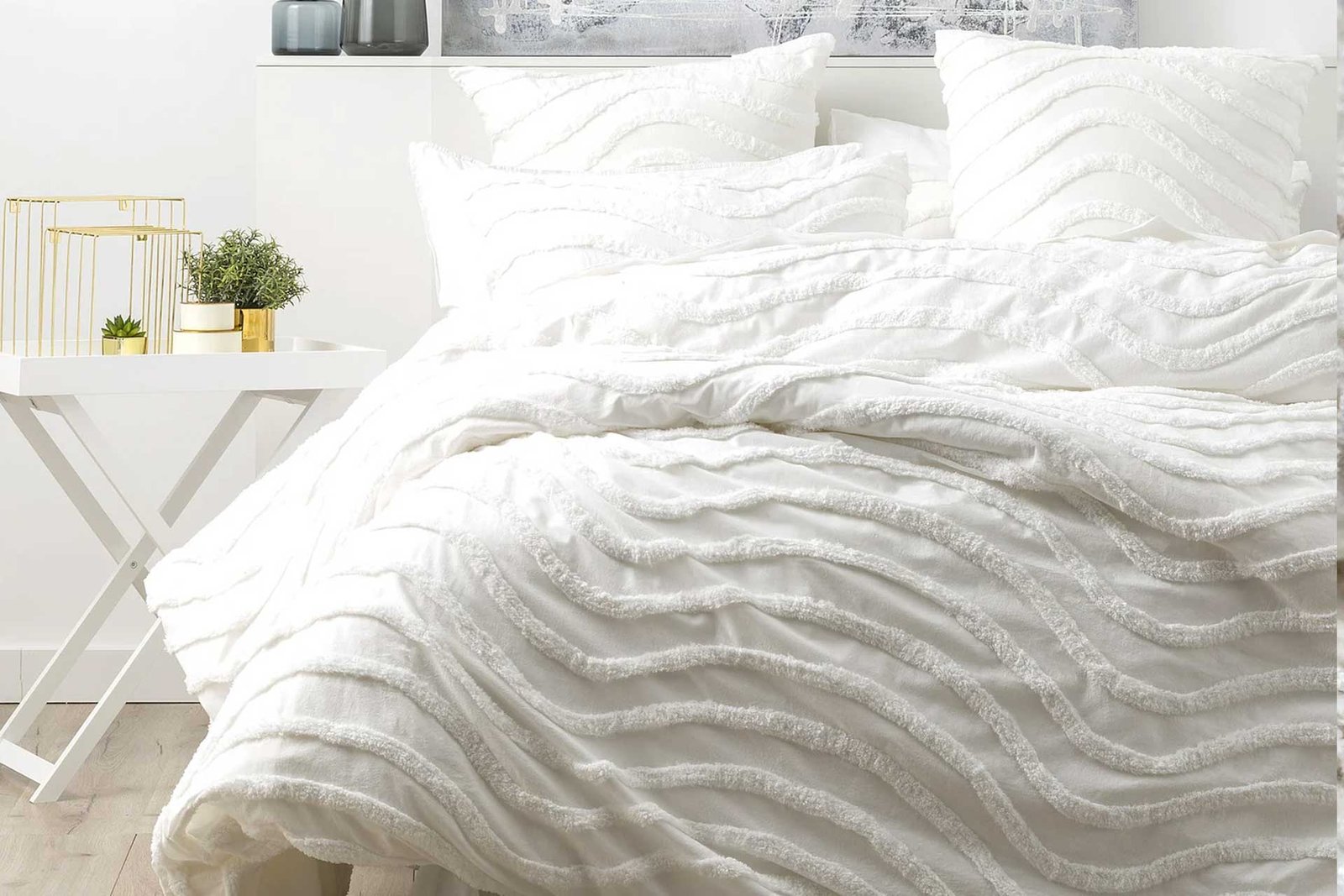 vintage-style white cotton chenille quilt on a bed